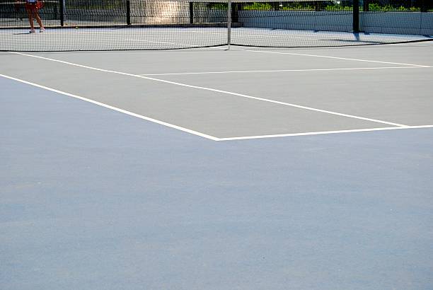 Rénovation terrain de tennis en béton poreux paris