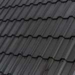 a close up of a roof with a black shinnel
